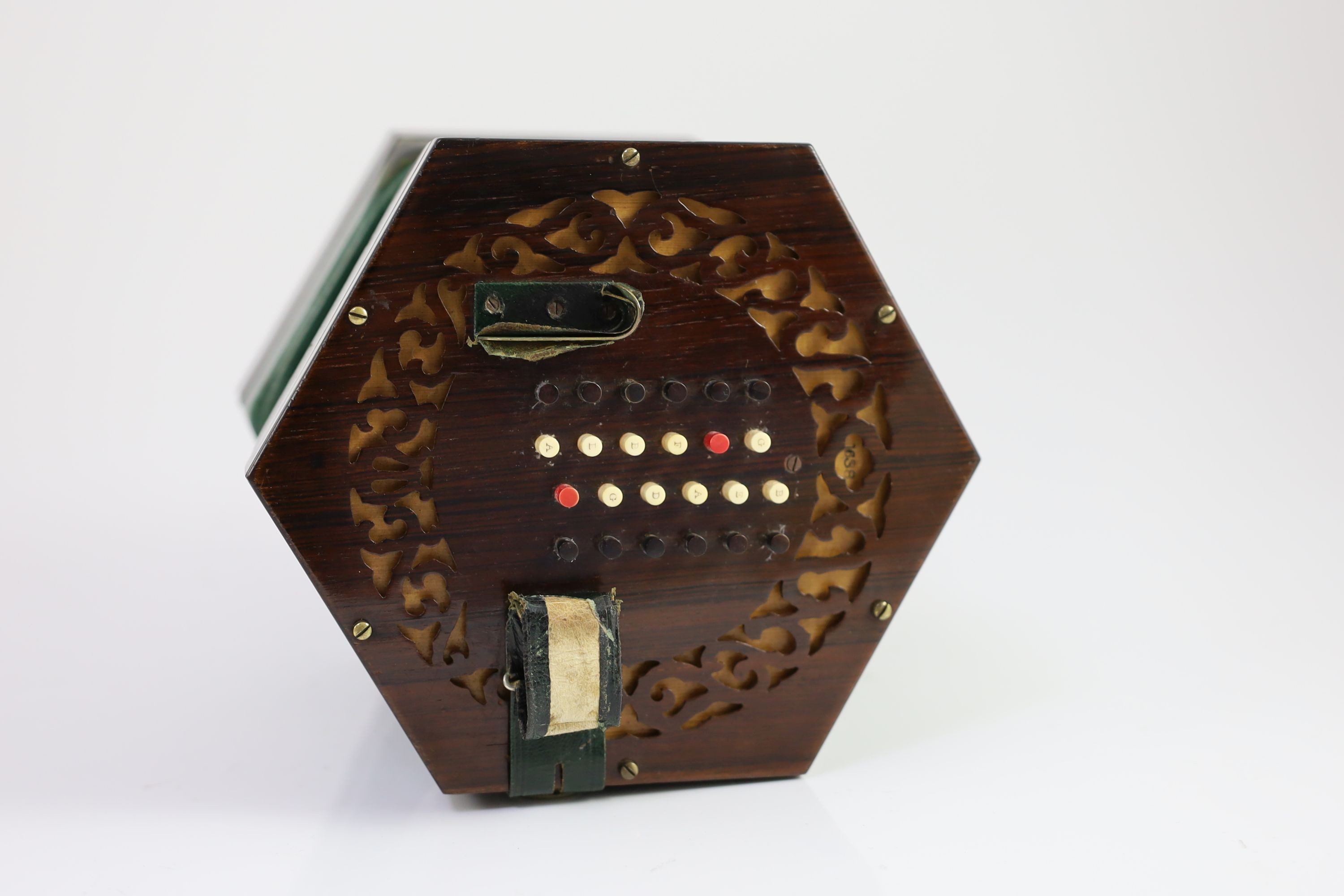 A 48-key C. Wheatstone English model rosewood concertina, diameter 18cm, housed in the original rosewood case